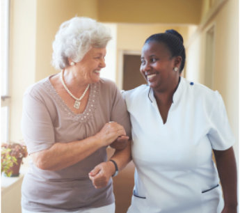 caregiver assisting elderly woman